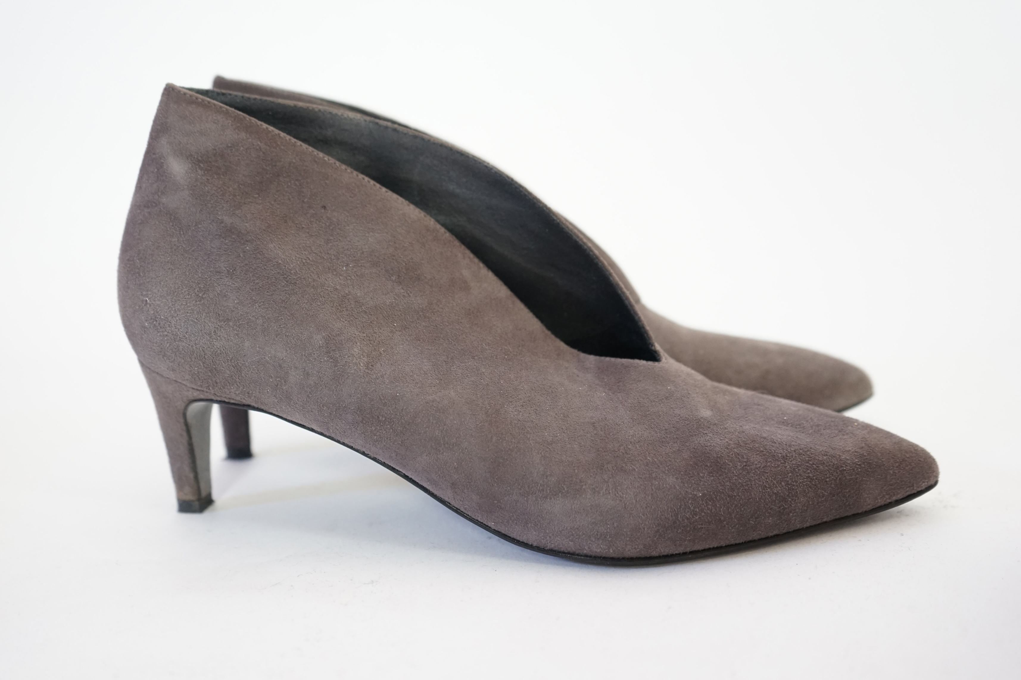 Three pairs of lady's shoes, Jigsaw V front shoe boot size 39, Marks & Spencer bright pink suede size 5.5 and a pair of Moda in Pelle buff platformed flats with metallic silver strip through sole. Proceeds to Happy Paws